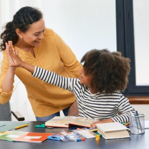 child giving high five